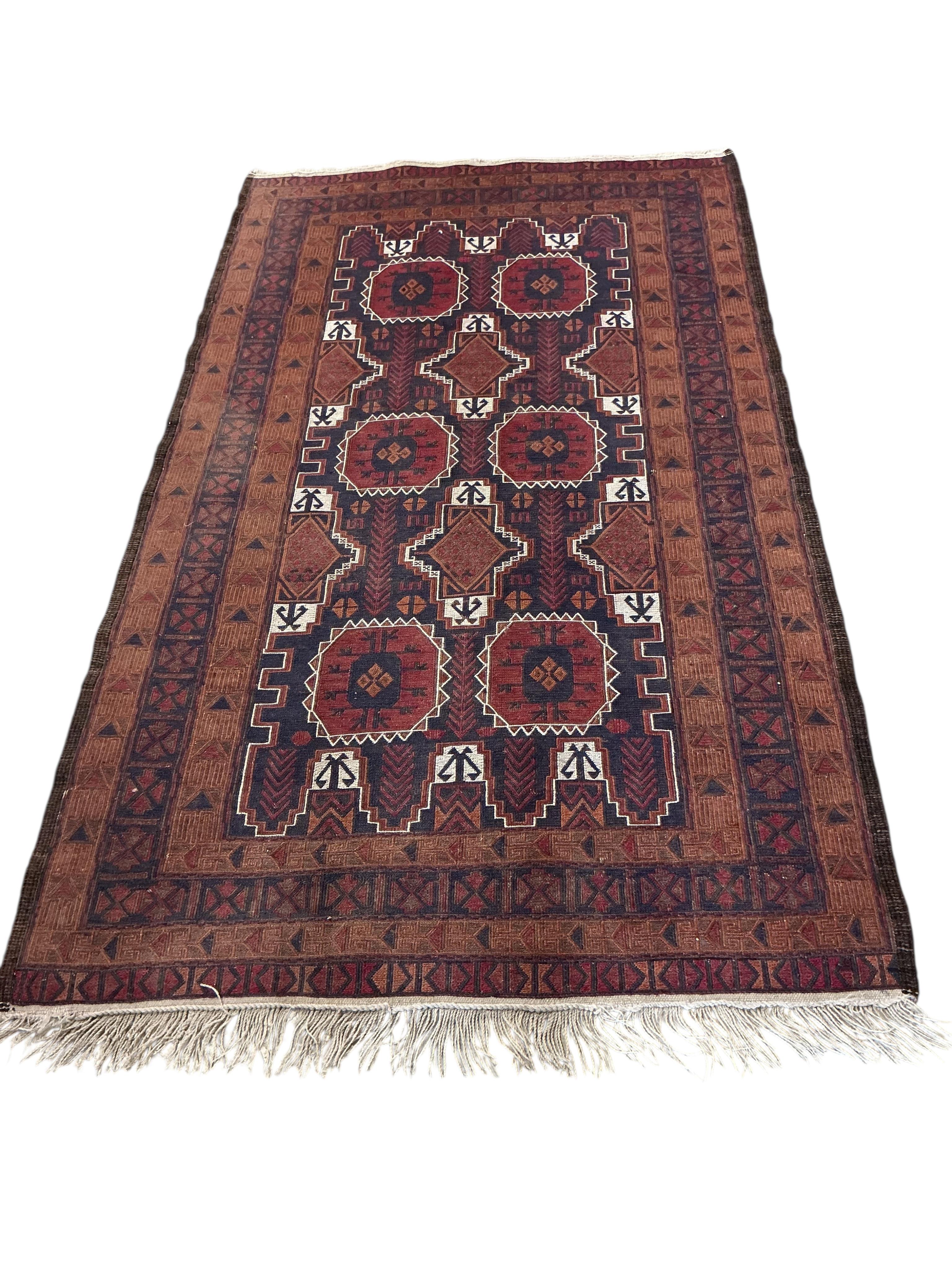 An Afghan red ground rug, a Kilim rug and a Caucasian rug, largest approx. 200 x 110cm